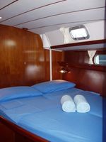 king size bed on port side in master cabin