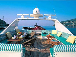 FlyBridge lounge & dining plus aft sundeck with lounge chairs.