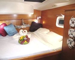 Port forward Stateroom Queen Bed. All rooms have 2 fans and a hatch to catch natural ocean breezes.