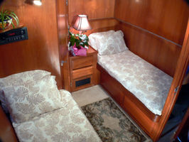 Starboard Stateroom with 3 single beds, LCD TV, DVD, granite counter in bath, great for families.