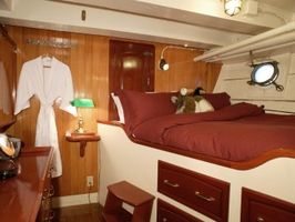 Queen Stateroom. Additional drop down single bed not shown.