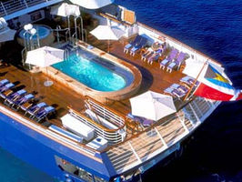 SeaDream excellent aerial picture of the yacht from the aft showing the very large pool deck 3 area along with the hot tub. Also visible are the Balinese sunbeds on deck 6 aft.