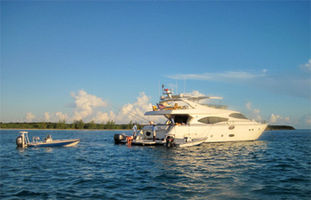Yacht with 2 flats boats and inflatable tender