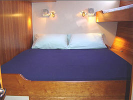Aft Cabin, with Double Bed and Single Bed in upper right. Double bed is 75" long, 59" wide at head, 48" wide at feet. Can be converted to 2 singles with dividing board.