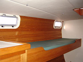 Single bed, above double bed in aft cabins. 74" long, 22" wide, with optional "lee cloth" to keep you in bed.